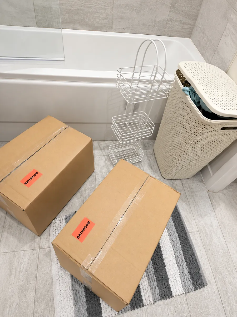 Bathroom items packed and tagged with stickers by Leaways Removals ready for the move