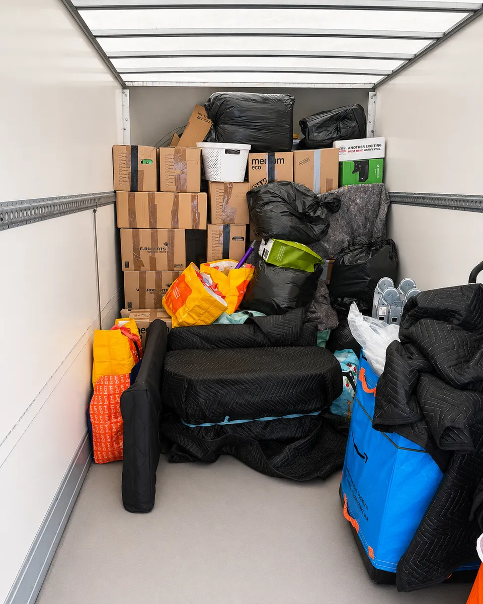 Leaways Removals van loaded with wrapped furniture, boxes and protected sofa cushions